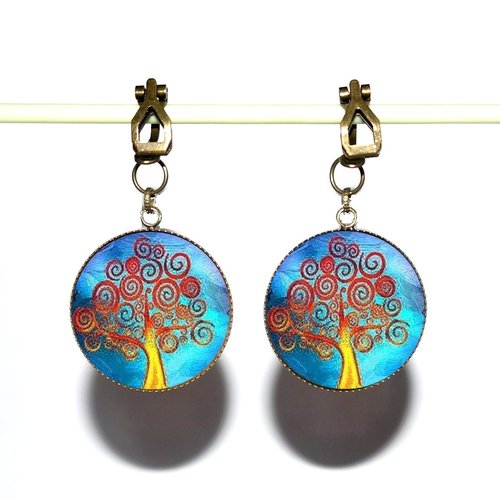 Clips d’oreilles bronze avec cabochons synthétiques * arbre sur fond bleu *
