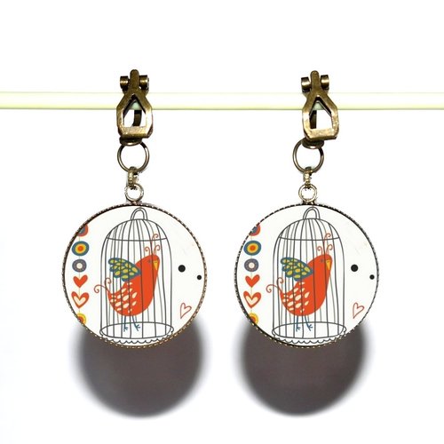 Clips d’oreilles bronze avec cabochons en résine * oiseau dans sa cage *
