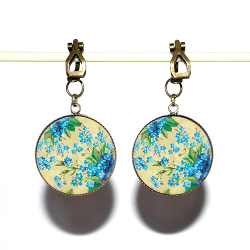 Clips d’oreilles bronze avec cabochons en résine * fleurs bleues *