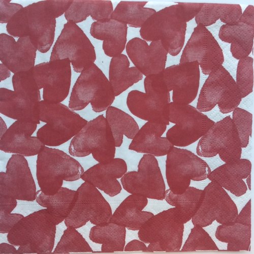 Serviette en papier motif coeurs rouges enchevétrés sur fond blanc 