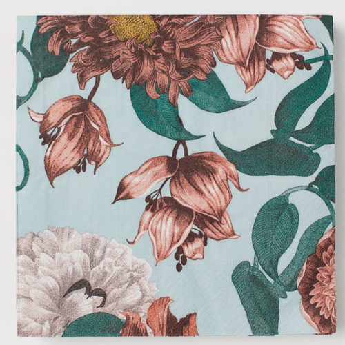 Serviette en papier motif dessins feuilles et fleurs colorées sur fond bleu lavande
