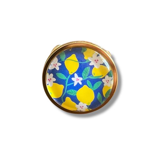 Bague acier inoxydable doré citrons jaunes sur fond bleu