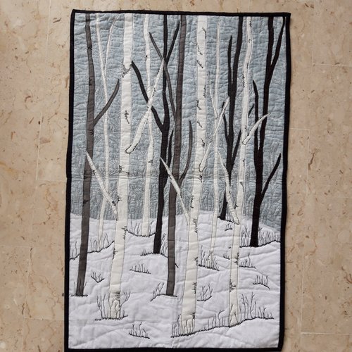 Art textile, patchwork représentant une forêt en hiver