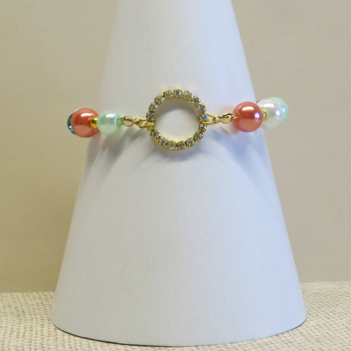 Bracelet  anneau strass doré et perles de verre blanche, orangé, vert pâle, bleu café et jaune.