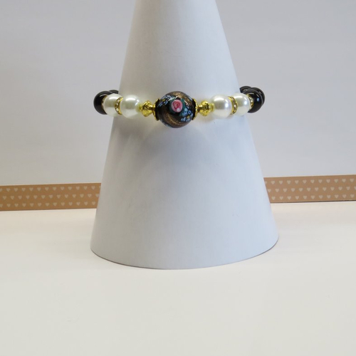 Bracelet grande perle ronde de verre motif floral rose, vert, bleu.