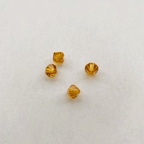 4 perles toupies 6 mm ambre en cristal swarovski