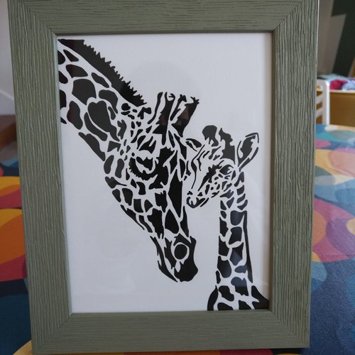 Cadre vert maman et bébé girafe