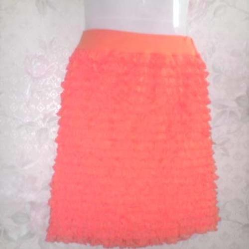 Petite jupe  en jersey extensible couleur orange cinture elastiquée , taille 38/40/42 longueur 47 cm.
