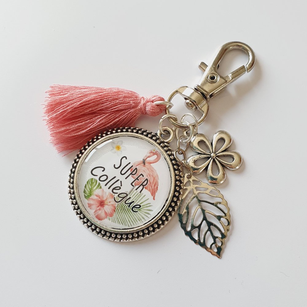 Porte-clés créatif flacon avec fleur rose sèche sur