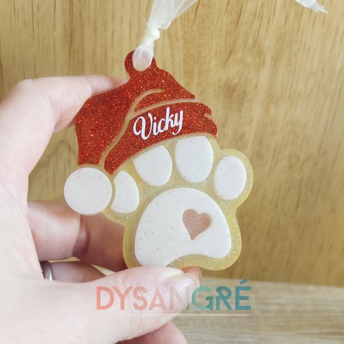 Ornement de noël en résine pattes de chien et bonnet