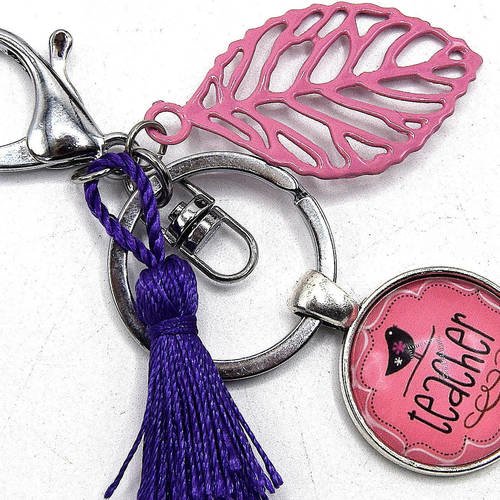 Porte-clés cabochon teacher -cabochon rose avec oiseau et pompon violet, feuille métal rose, porte clés en métal argent