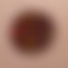 Bouton original en émaux sur cuivre.