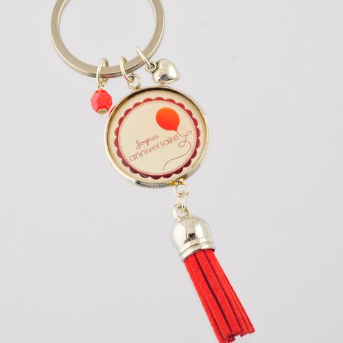 Porte-clef "joyeux anniversaire" avec pompon, perle et breloque