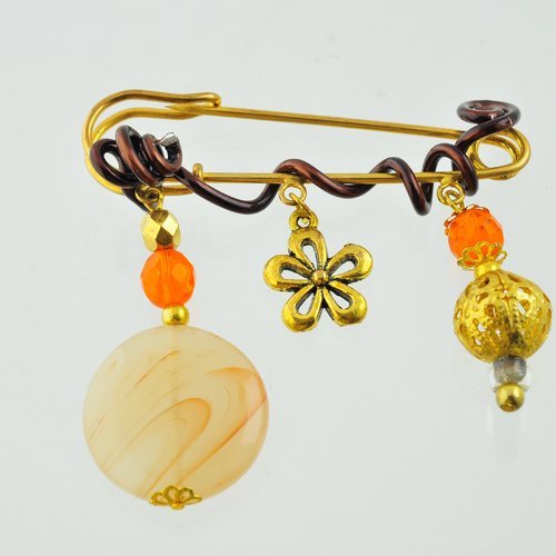 Broche dorée et orangée