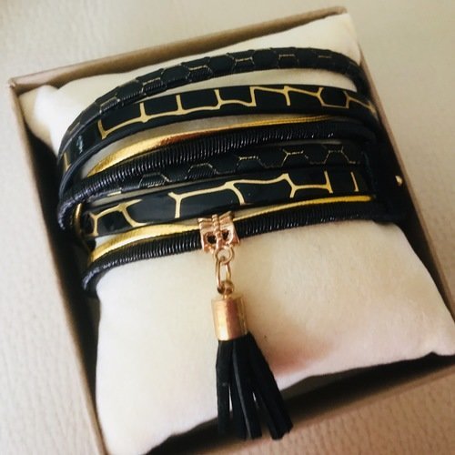 Bracelet manchette noir et or avec pompom noir 