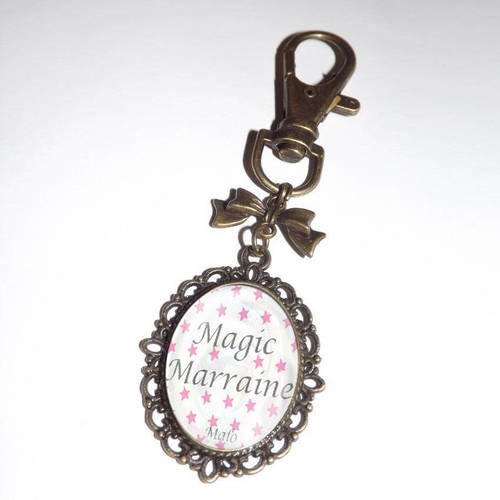 Porte clef, bijou de sac,cabochon en verre,fond étoile rose magic marraine + prénom 