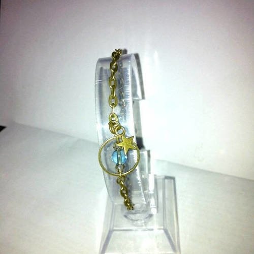 Tres jolie bracelet bronze "saturne" avec perle cristal,verre et breloque étoile,ton bleu 