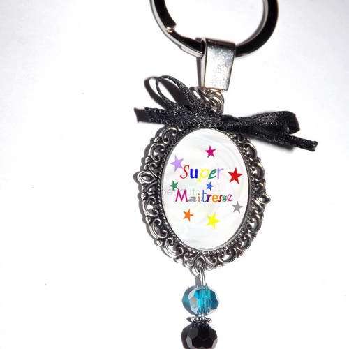 Porte clef, bijou de sac,cabochon en verre, super maitresse, perle cristal noir et bleu 