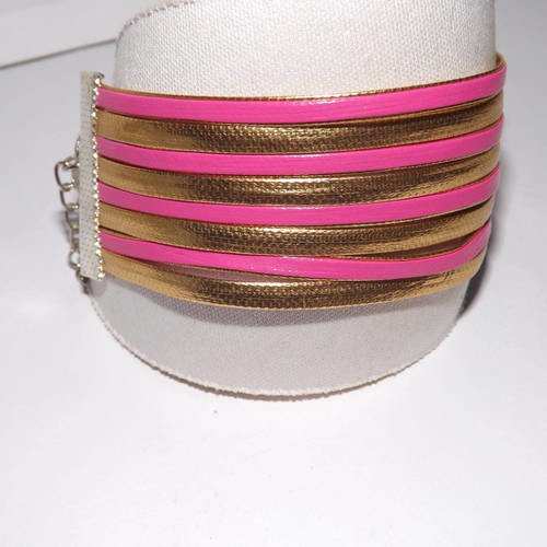 Manchette/ bracelet à lannière doré et rose fuchsia, imitation cuir ,8 rangs 