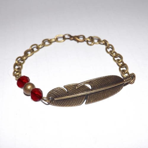 Jolie bracelet plume ethnique , bronze avec perle cristal rouge 