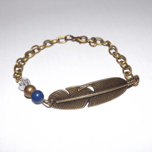 Jolie bracelet plume ethnique , bronze avec perle bleu lapis lazuli cristal transparent 