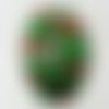 Pendentif ovale vert bombé avec feuille argentée et rayée 52mm