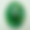 Pendentif volutes vert et bleu rond bombé verre avec feuille argentée 50mm