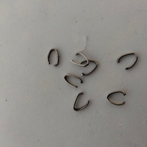 7 anneaux ovals en acier argenté 8x5mm