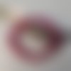 Bracelet en perles rose fuchsia sur élastique