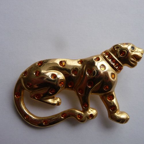 Broche leopard metal dore avec strass jaunes