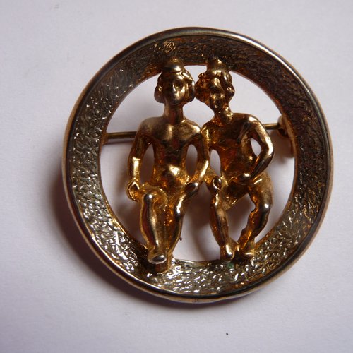 Broche ronde  "gémeaux" signe zodiacal - métal doré et argenté