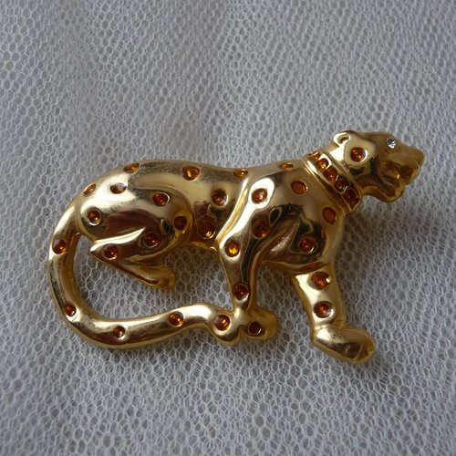 Broche leopard metal dore avec strass jaunes