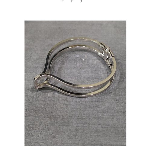 Support de bracelet rigide en métal argenté