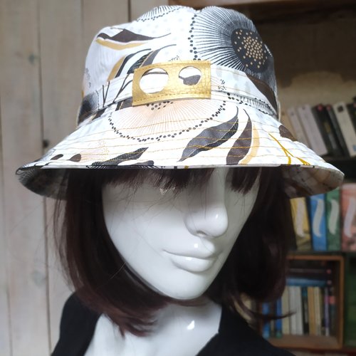 Chapeau de pluie pissenlit ocre et noir