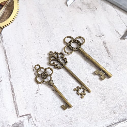 Pendentifs breloques clés couleur bronze en métal x3 mixte