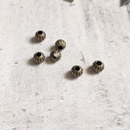 Perles rondes intercalaires métal bronze 6mm x5