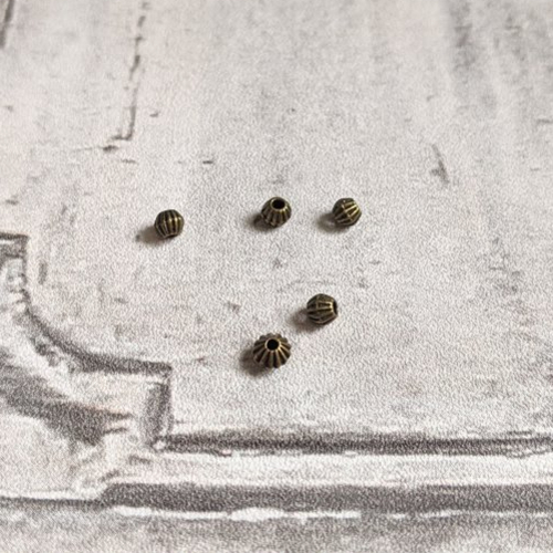 Perles toupies intercalaires métal bronze 3 mm x19