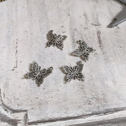 Breloques papillons métal argenté 15x22mm x2