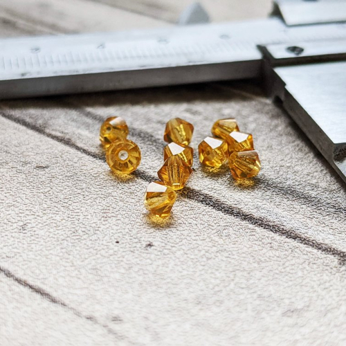 Perles toupies à facettes en cristal de verre jaune orangé 4 mm x10