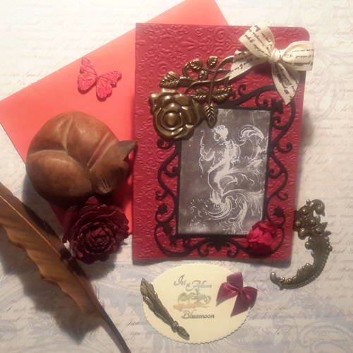 Carte double et enveloppe. embossée. ange et fioritures. grande rose, metal bronze, noeud satin écritures. 