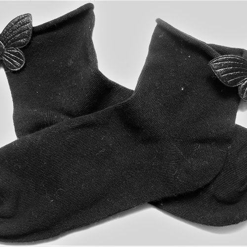 Chaussettes noires avec papillons pailletés