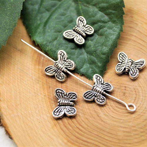 Perles papillons en métal argenté 10*8 mm