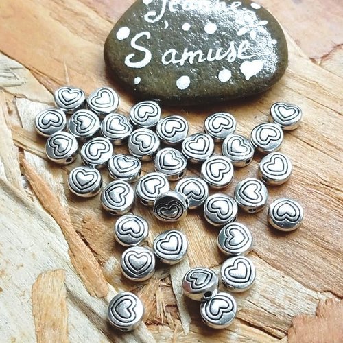 Perles plates rondes cœur 6 mm