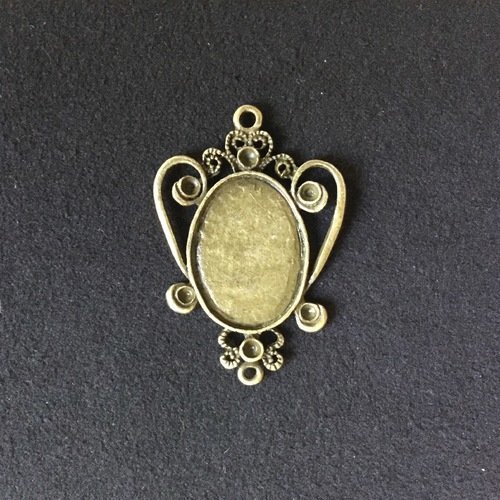 Connecteur pendentif motif dentelle bronze pour cabochon ovale 25x18 mm