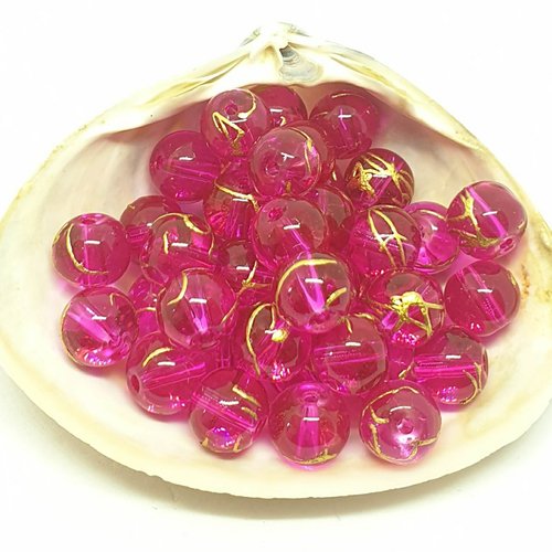 Lot de 10 perles en acryliques rondes et fuschias striées dorées