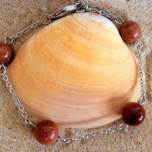 Bracelet en acier et 4 perles de sables bruns dorées