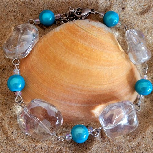 Bracelet en acier et 4 perles effet caillou transparentes