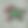 Doudou de bain - étoile verte aux pois roses