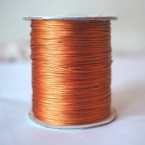 Cordon de polyester très fins 0.05 mm couleur cuivre orange vendu au mètre *pour bracelet* 