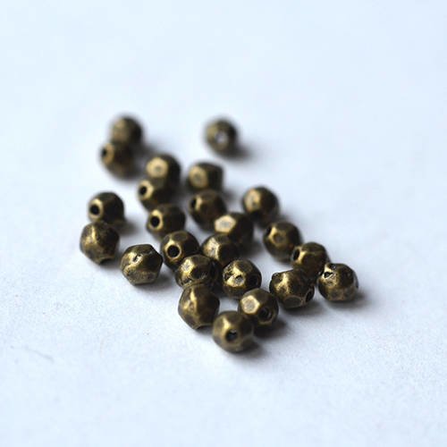 Lot perle metal à facette ovale métal bronze 4 mm x 10 